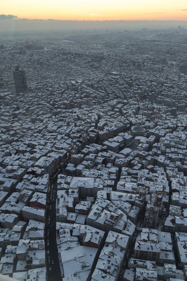 What are the challenges and strategies for real estate development in densely populated urban areas?